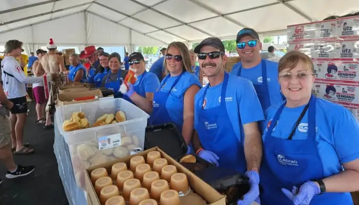 Classic Carriers volunteers working the chicken line at poultry days.