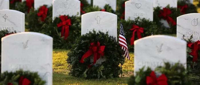 Veterans graves with wreaths on them
